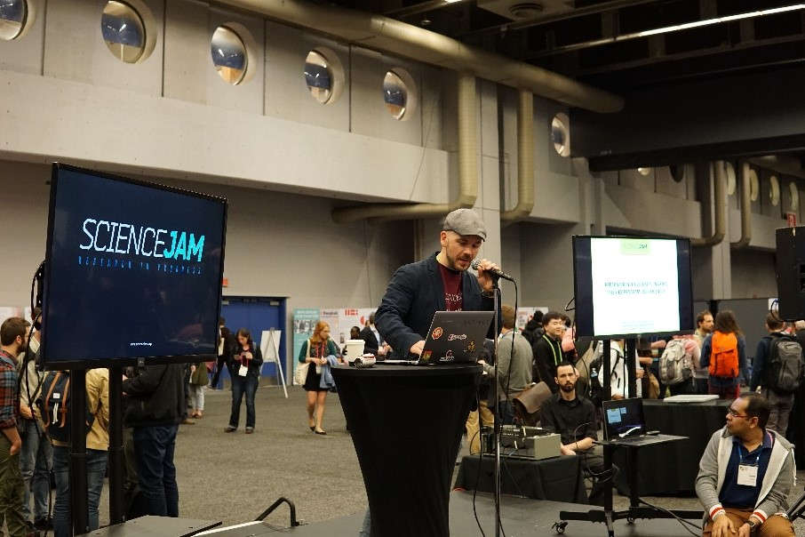 Preparing for the outcome presentations in the main conference exhibit hall.